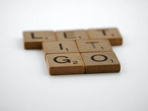 board game letters spelling out phrase let it go