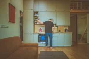 motion photo of person standing in kitchen