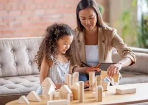 play therapist helping kid with play therapy